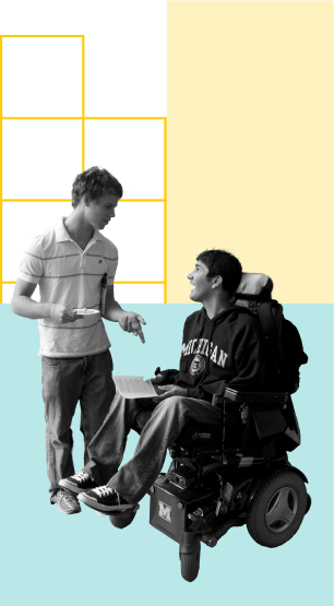Two people talking. One is using a wheelchair.
